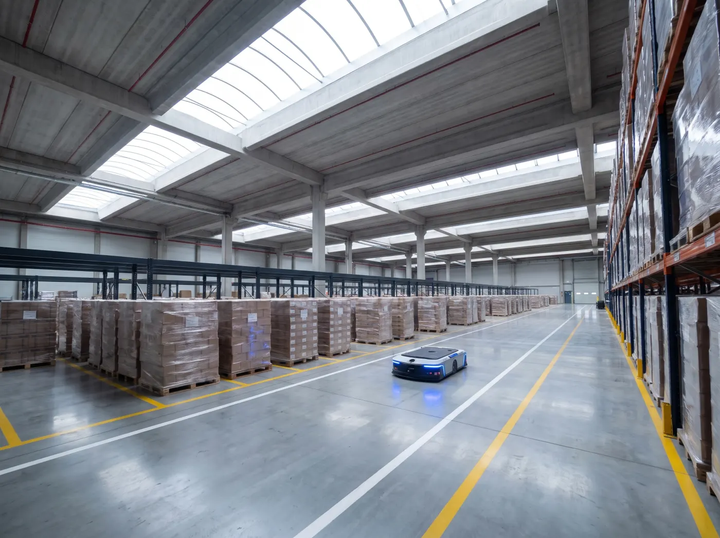 Modern logistics hall with an automated vehicle